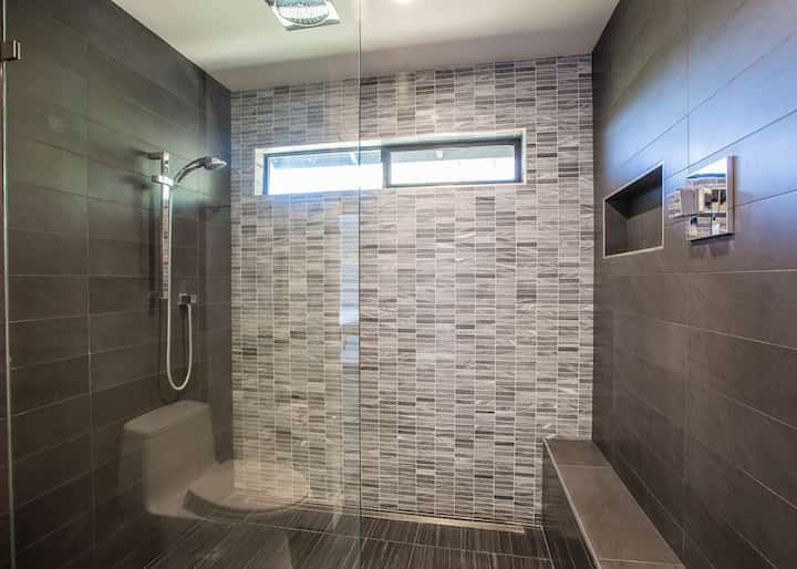 Walk-in shower installation give functioanlity and accessibility for guests in homes in Victorville, CA.